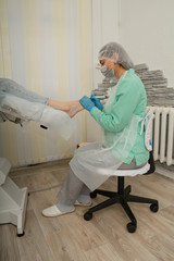 Podology. The doctor podolog makes medical pedicure. Feet care. Cosmetology