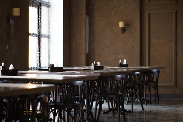 Vintage room cafe or restaurant. Tables opposite the window.