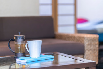 Tea cups and tea makers placed on the table in the living room at home