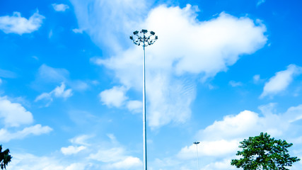 Street Public lighting pole against a blue sky and cloud background.