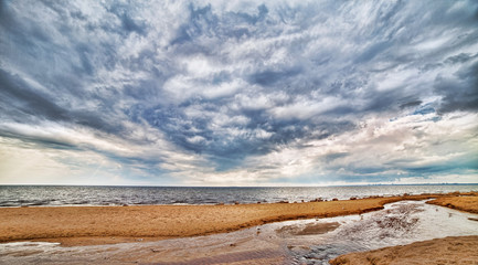 sea coast under heavy sky