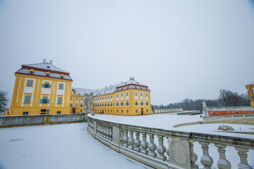 Fototapeta na wymiar Schloss Hof, Austria - February 20, 2017:Schloss Hof is a baroque palace in Lower Austria, which privious owners include Prince Eugene of Savoy and Maria Theresia,with falling snow.