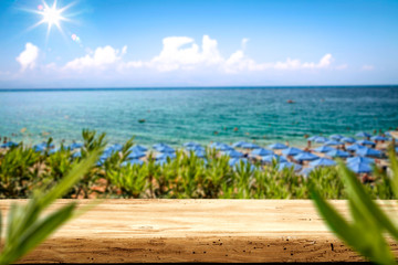 Desk of free space and summer beach background 