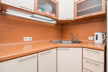 The photo of a sink in a The photo of a sink in a  kitchen