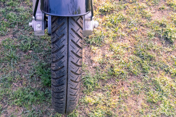 Bike front tire on green ground