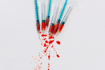 Treatment against addiction. Syringe with blood. Immunodeficiency.