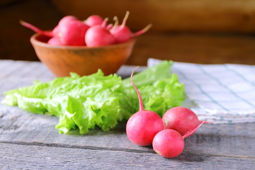 Fresh radish on a wooden background.