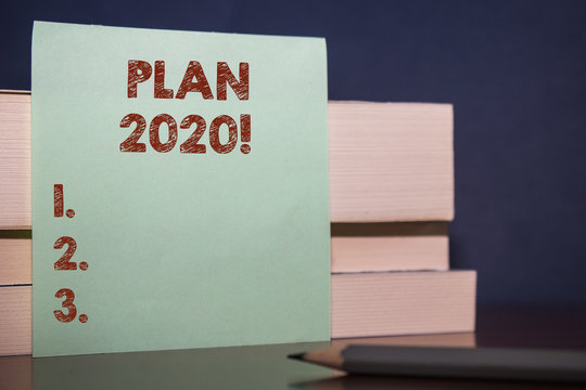 Handwriting text Plan 2020. Conceptual photo detailed proposal doing achieving something next year Close up three wooden different sizes rectangle boxes paper sheet pencil