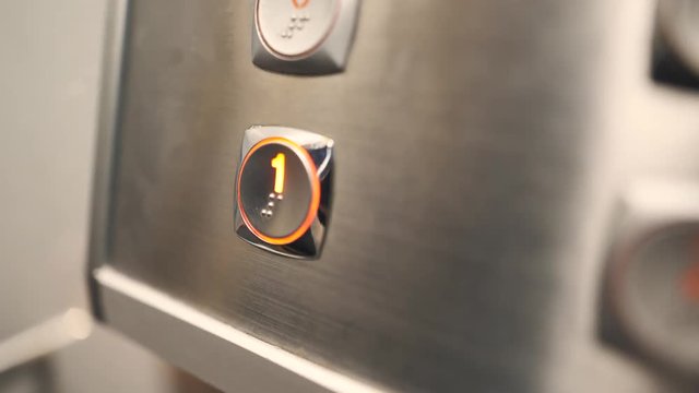 Pressing the button number 1 (one) on an elevator