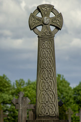 The carved column of a Celtic Cross gives this highly decorated symbol that dates back to the Middle Ages and even more imposing look to a last resting place