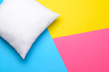 Soft pillow on color background