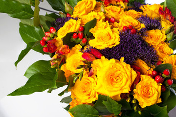 Bright bouquet with yellow roses close-up