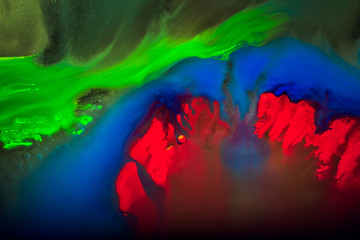 Colorful and creative abstract background of dye on glass