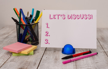 Writing note showing Let S Discuss. Business concept for asking someone to talk about something...