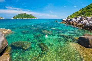 Fototapeta premium Rocky seashore beach turquoise sea water