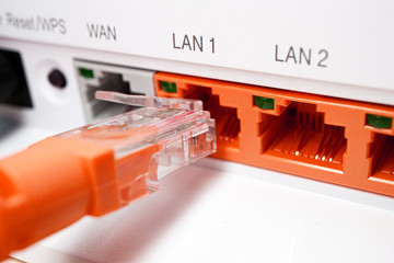 red patch cord utp 5e cable inserted into red free port