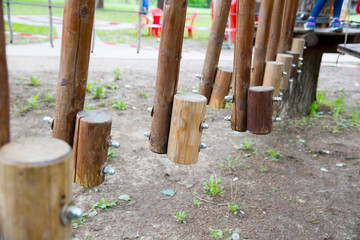 Children's Adventure Park bridges, ropes and stairs. Adventure climbing on high wired park. Course of high ropes in forest. 