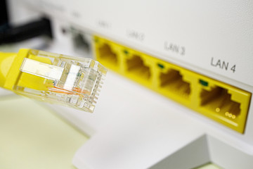 ethernet connector close-up on the background of a home router for Internet access with