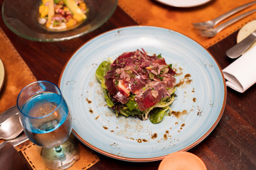 Salad Ham with italian sauce on plate course set of Spanish food Cuisine culinary which a bit hot and unique taste on wooden table.