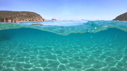 Underwater sea level photo of famous crystal clear turquoise sandy beach of Pori in Koufonisi island, Cyclades, Greece