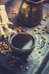 Cup of morning coffee on the rustic wooden background. Selective focus. Shallow depth of field.