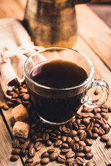 Cup of morning coffee on the rustic wooden background. Selective focus. Shallow depth of field.