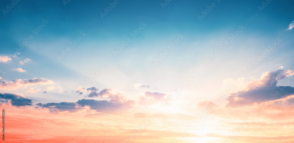 Wall mural background of colorful sky concept: dramatic sunset with twilight color sky and clouds