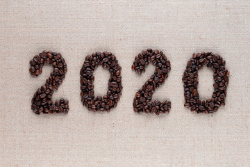 2020 writing from coffee beans, shot close up