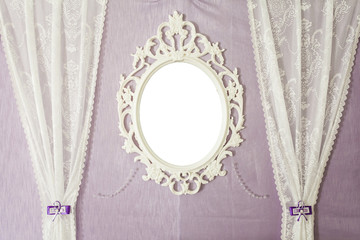 White vintage mirror on the wall. Close-up