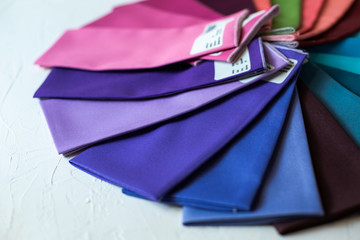 A Group of Twisted Colored Fabric on white
