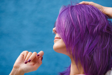 girl with purple hair on blue background