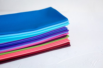 A Group of Twisted Colored Fabric on white