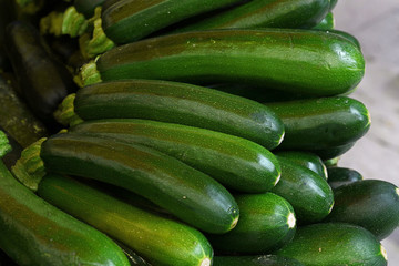 Close up fresh green zucchini on retail display