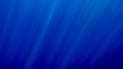 Beautiful photo of sun rays shining through deep sea surface.