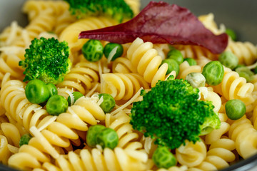 Pasta with broccoli and green peas