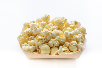 Popcorn in paper cup isolate on white background.
