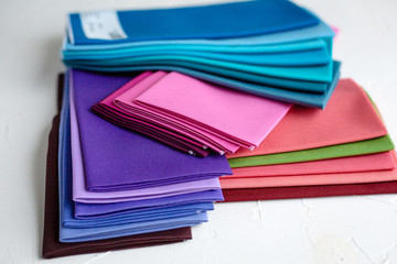 A Group of Twisted Colored Fabric on white