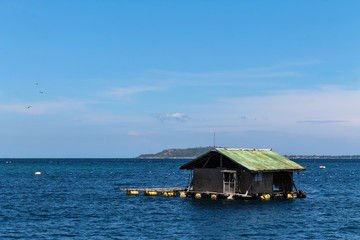 BALI, INDONESIA - December 01, 2013: Floating wooden House just off the coast of Lombok, Balis neighbouring Island.