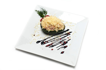 Served side dish on a white plate. Close-up. Isolated