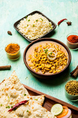 Black Eyed Kidney Beans Curry served in a bowl with Naan and rice