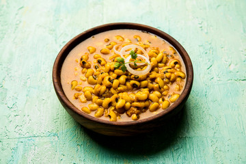 Black Eyed Kidney Beans Curry served in a bowl with Naan and rice