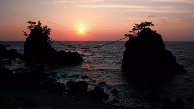 Sunset over Scenic Rocks and a Sea (time lapse): Hatagoiwa Rocks in Noto Peninsula, Ishikawa Pref., Japan 