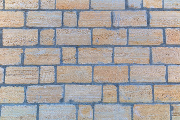 The texture of the wall of stone bricks