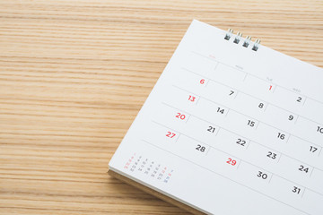 calendar page on wood table background