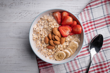 Homemade oatmeal with berry and fruit. Breakfast. Healthy food on white background