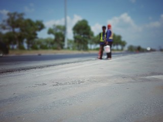 Obraz premium Road maintenance by burning old materials and improving quality