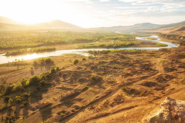 Caucasian landscape in backlit, Mtkvari river in Georgia