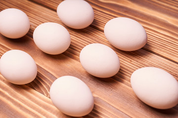 Chicken eggs laid on a wooden table