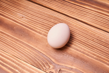 Chicken eggs laid on a wooden table