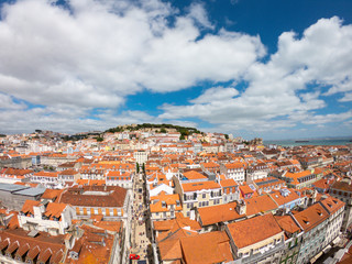 Obraz premium Aerial view on Buildings and street in Lisbona, Portugal. Orange roofs in city center